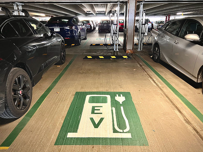 Image shows an empty electric vehicle charging parking spot