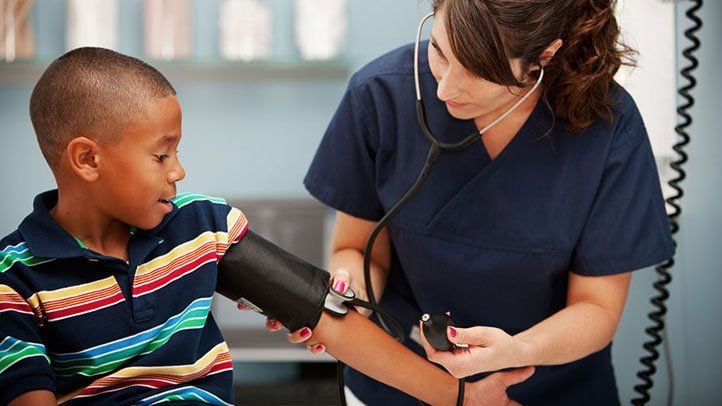 provider offering counseling to pregnant patient blood pressure levels among children