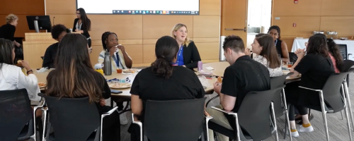 Students sitting around a round table