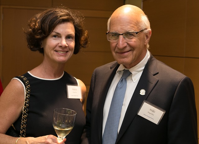 A female and male posing for the camera.