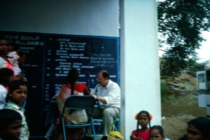 Doctor attends to a patient in India.