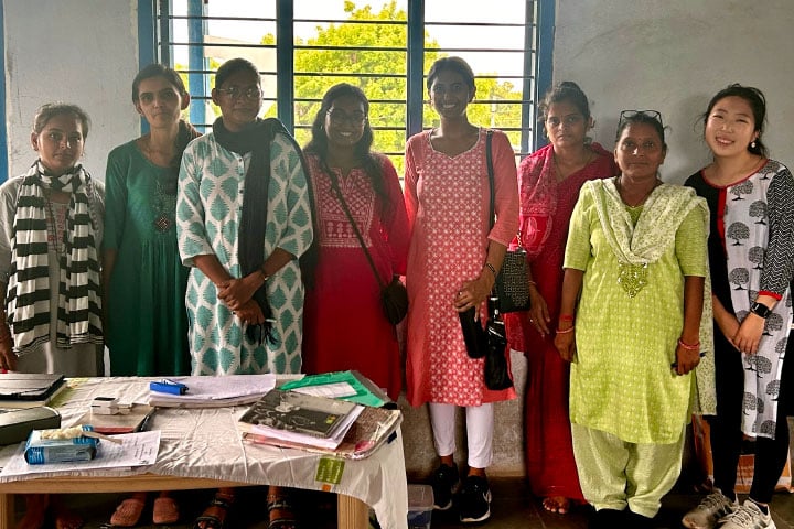 Several women posing for the camera.