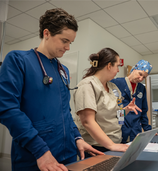 Nursing students talking in the Nursing Skills Lab at UMass Chan Medical School