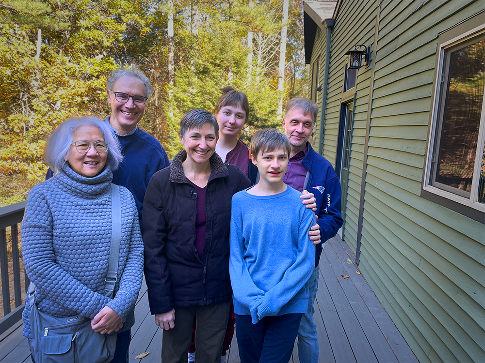 Rosalind &ldquo;Candy&rdquo; Lee, Victor Ambros, Melanie Barton-Zoltan; Tara, Daniel and Erik Zoltan stand outside together on the deck surrounded by trees in the background