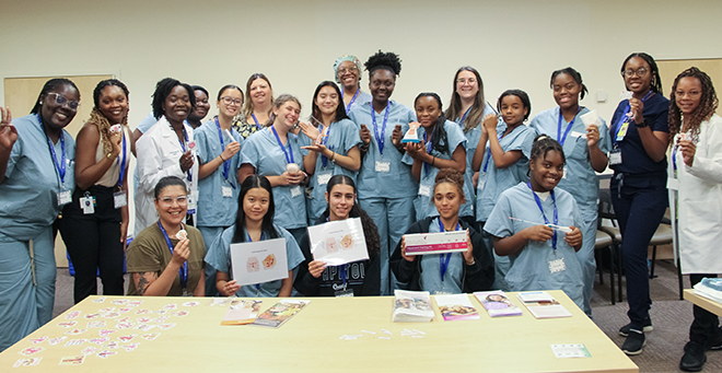 UMass Chan staff and participants from Girls Inc. during the &ldquo;Day in the Life of an OB-GYN" event.  