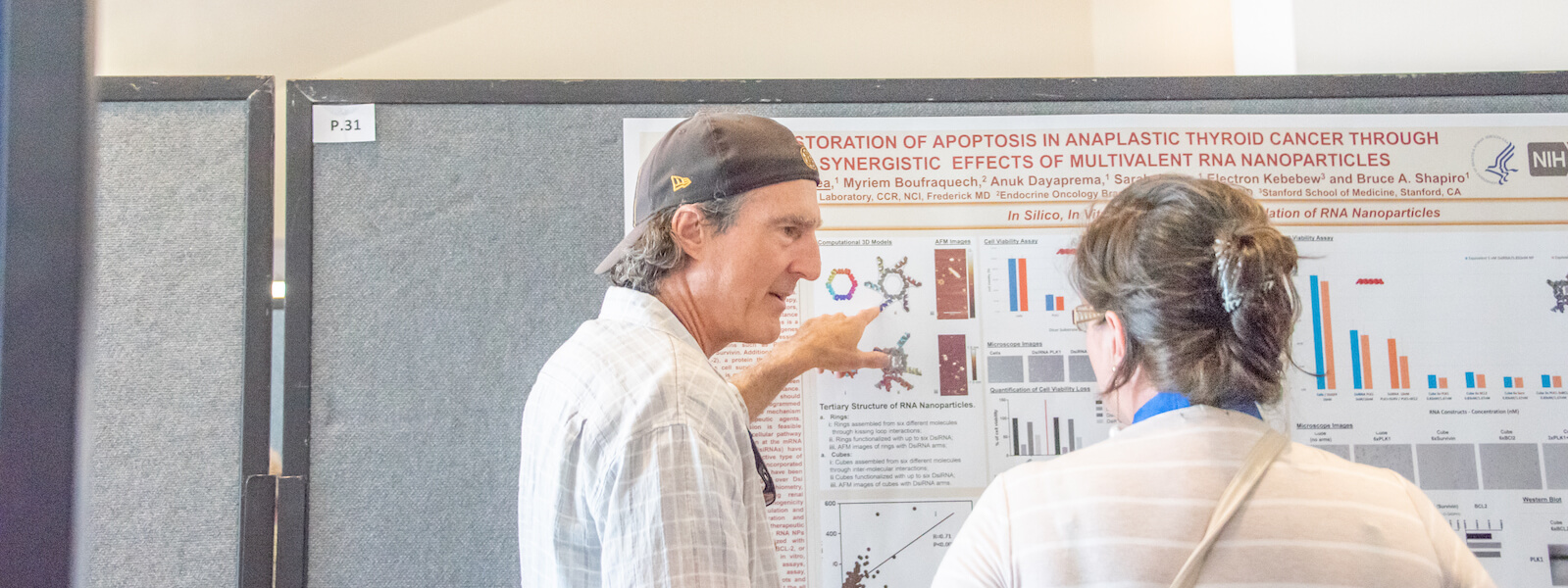 Craig Mello Looking at Presentation at RNATx 18 Conference