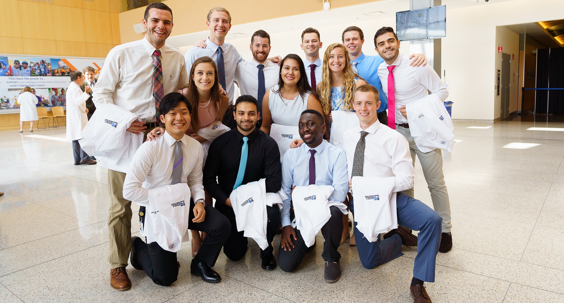 Group white coat in lobby resized.jpg
