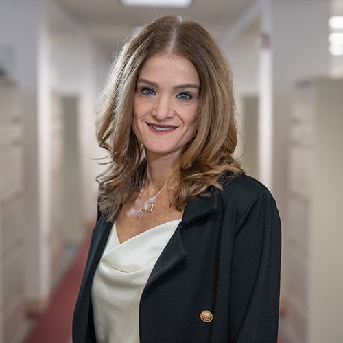 white middle aged woman with long dark blonde hair