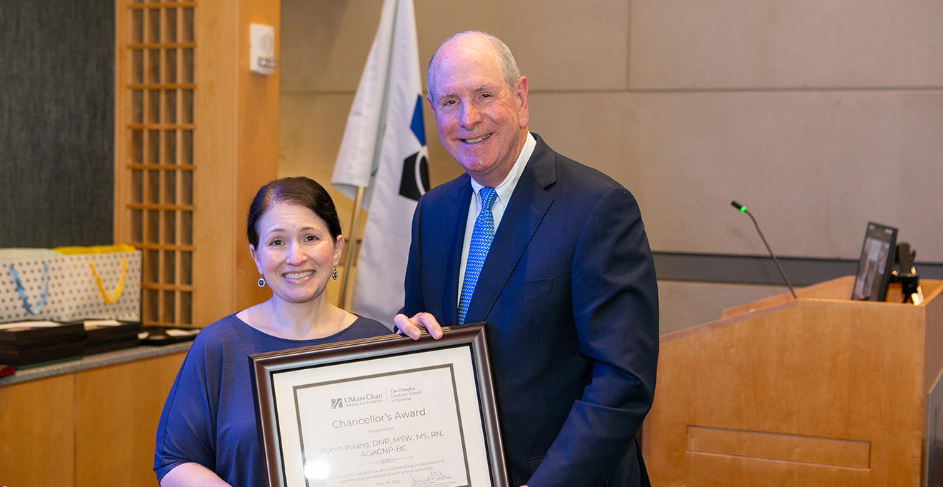 Photo of Chancellor Michael F. Collins presented the 2025 Chancellor&rsquo;s Award to Robin Young, MSW, MS, RN, AGACNP-BC. 