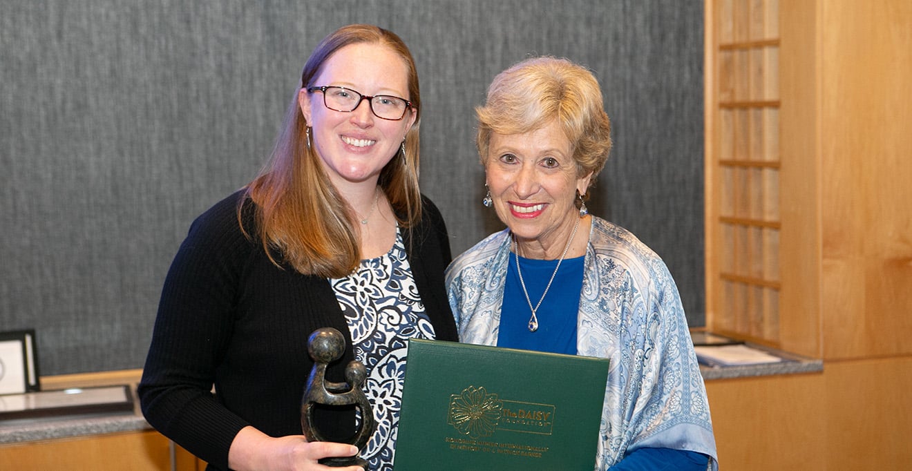 Photo of Dean Joan Vitello-Cicciu presented the Faculty Daisy Award to Amanda Cornine, PhD&rsquo;21, RN, CNE, assistant professor of nursing. 