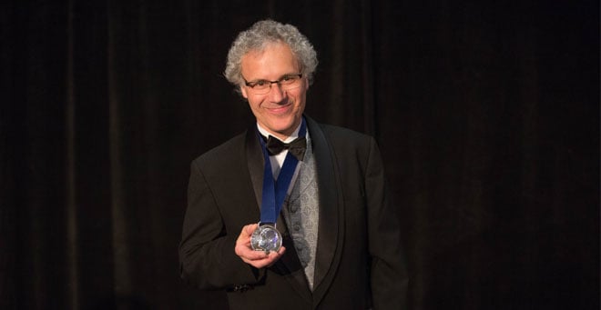 BALTIMORE, MAY 2, 2016 -- Victor R. Ambros, PhD, holds the silver medal in the design of the Roosevelt dime presented to him at a black tie dinner and ceremony as co-recipient of the 2016 March of Dimes and Richard B. Johnston, Jr., MD Prize in Developmental Biology. His co-recipient was Gary Ruvkun, PhD, of the Massachusetts General Hospital and Harvard University. Photo by Jason Turner